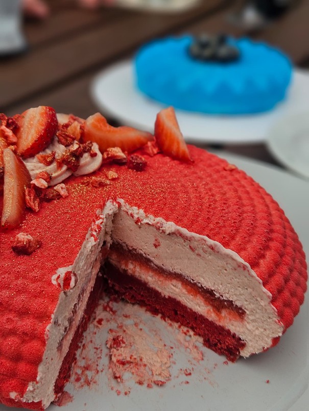 Mousse cake cut open showing the layers inside